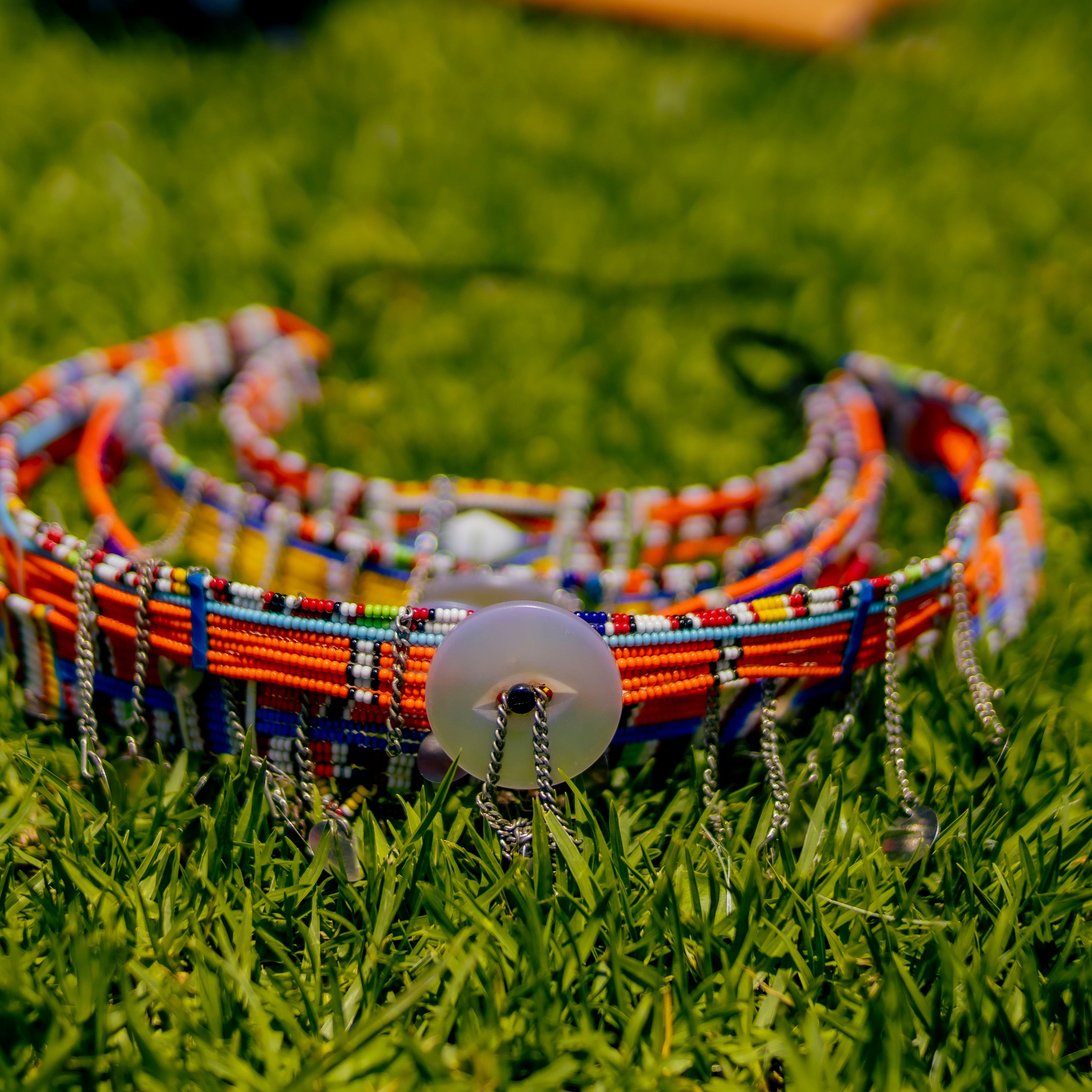 Colorful beaded bracelets on grass